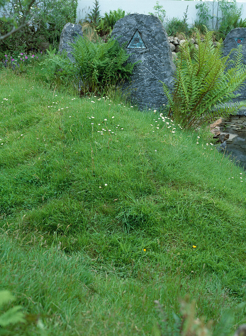 Stone sculpture with ferns