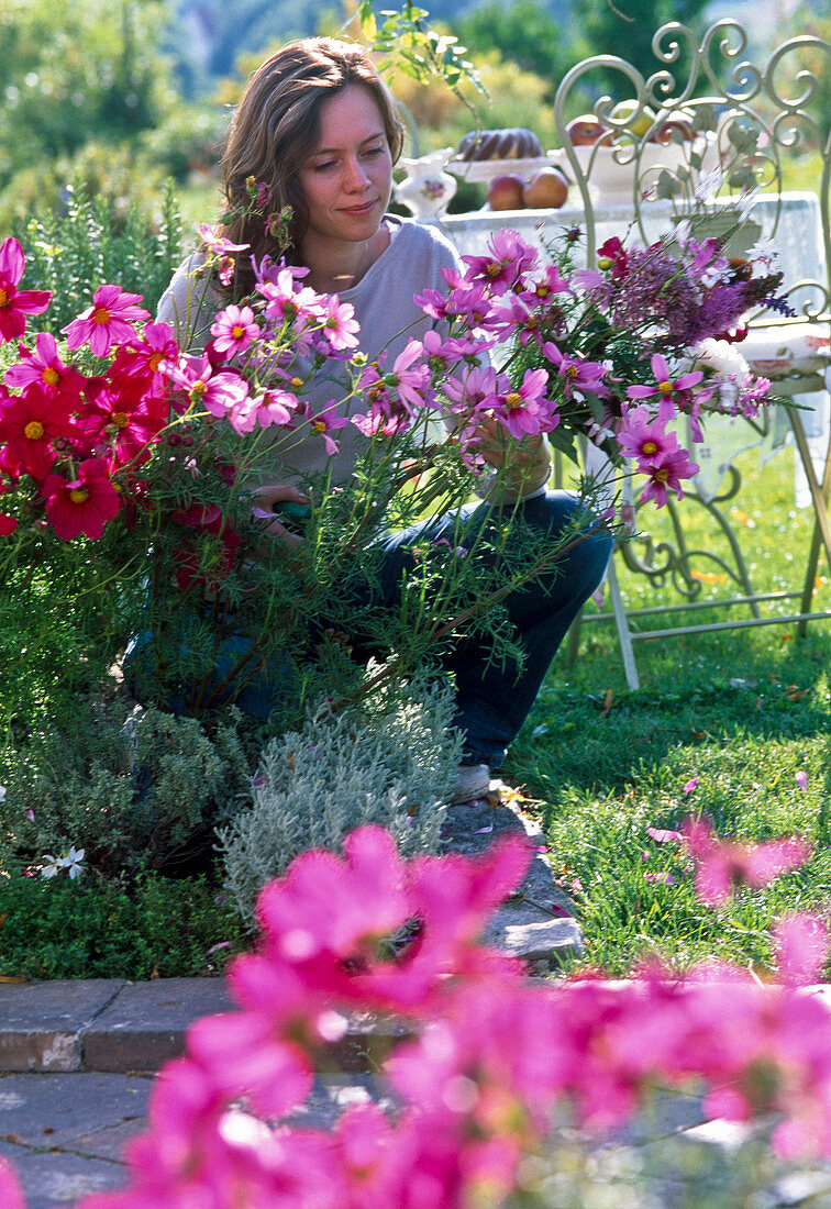 Young woman cutting bouquet