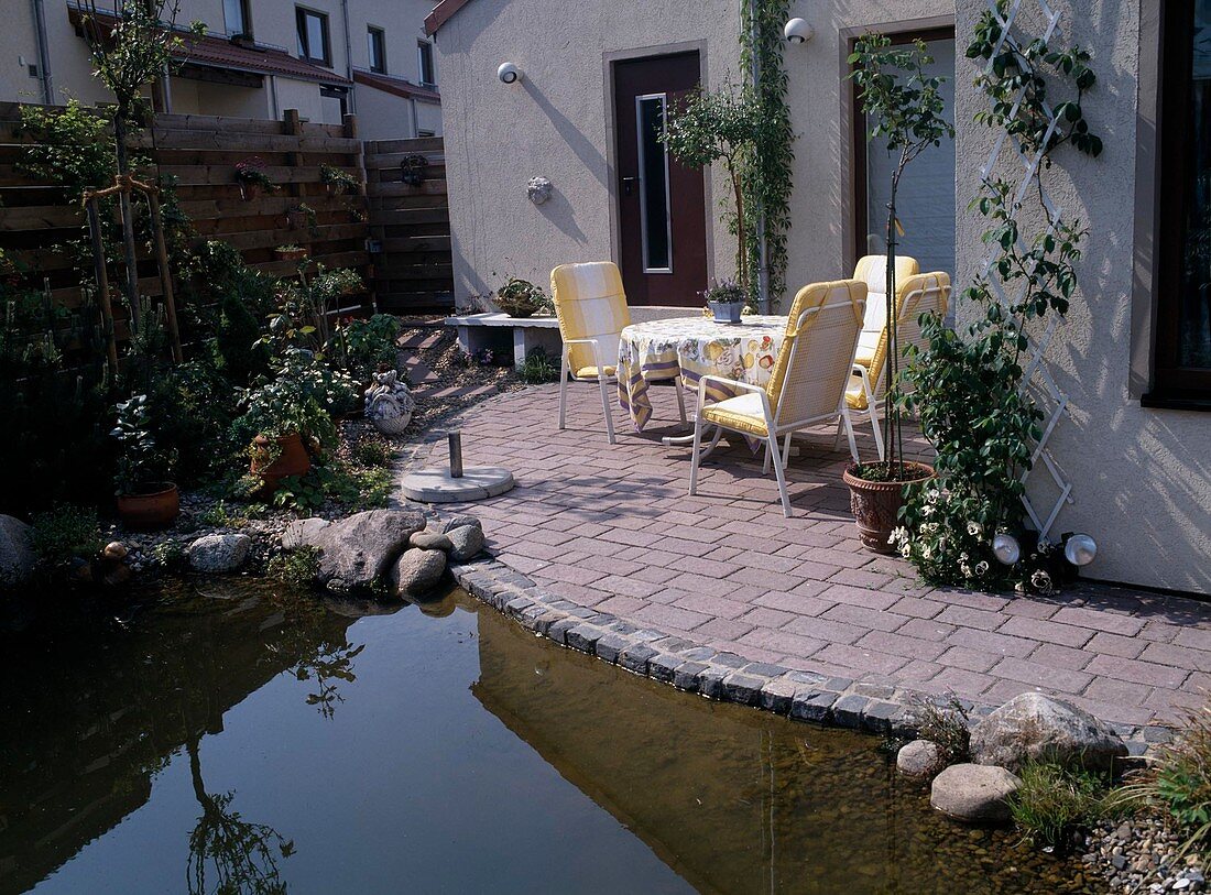 Terrace at the house with pond in front