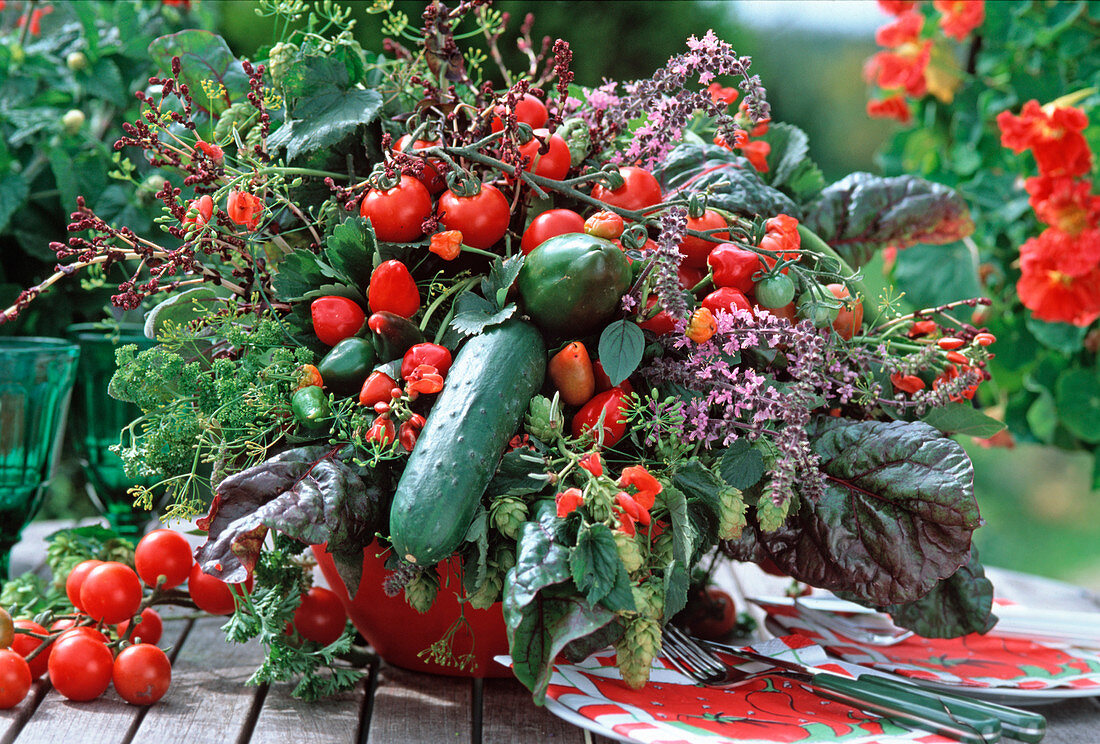 Vegetable bouquet of tomatoes, ornamental peppers, hops
