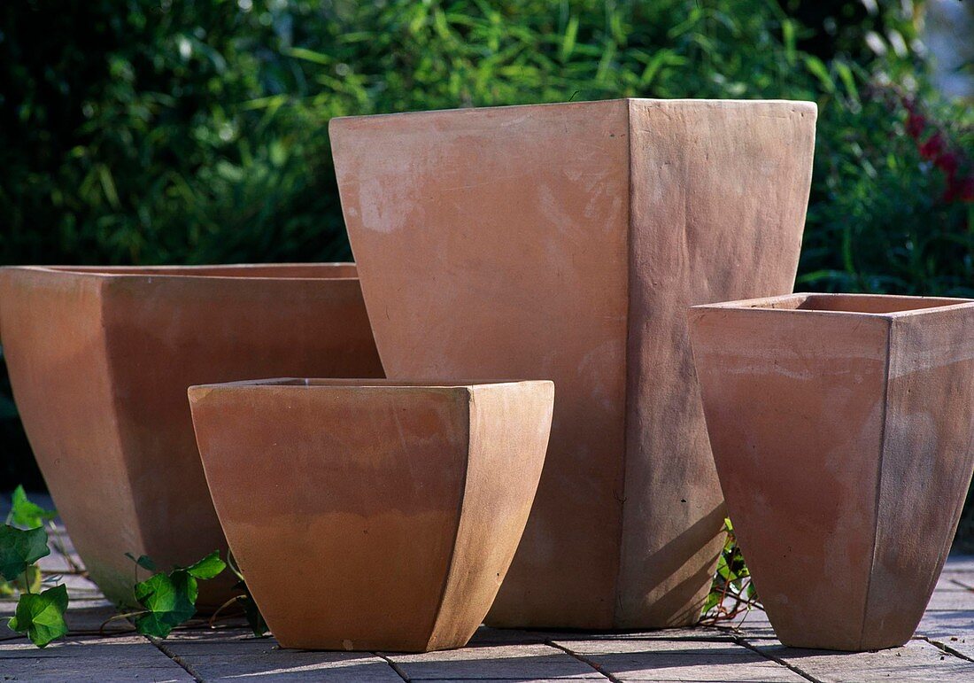 Modern forms of winterproof clay pots for potted plants