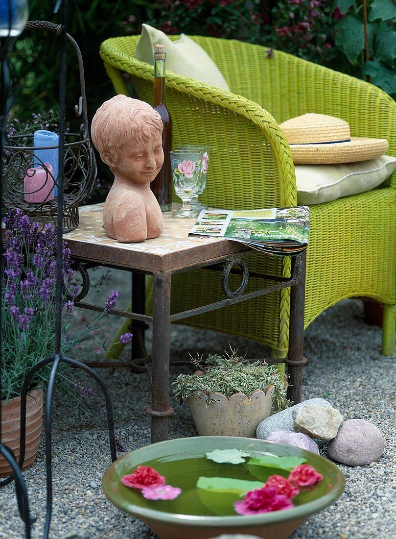 Wicker chair with table and bust