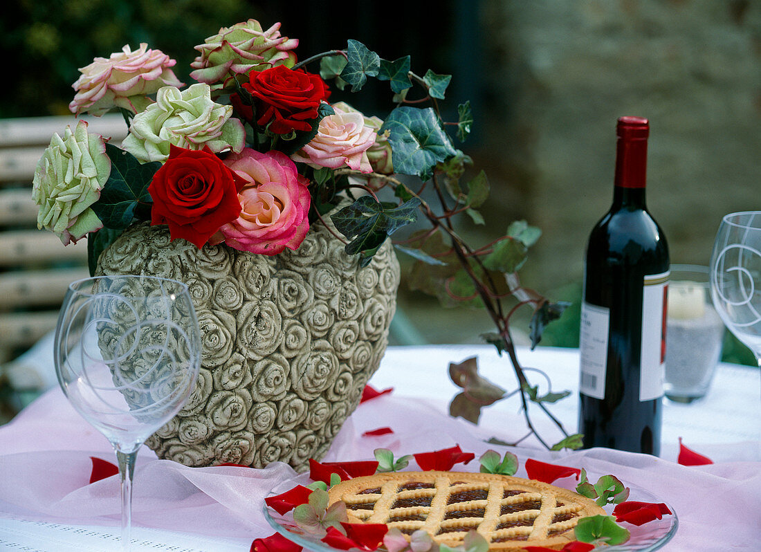 Various rose petals in a heart vase with rose petals