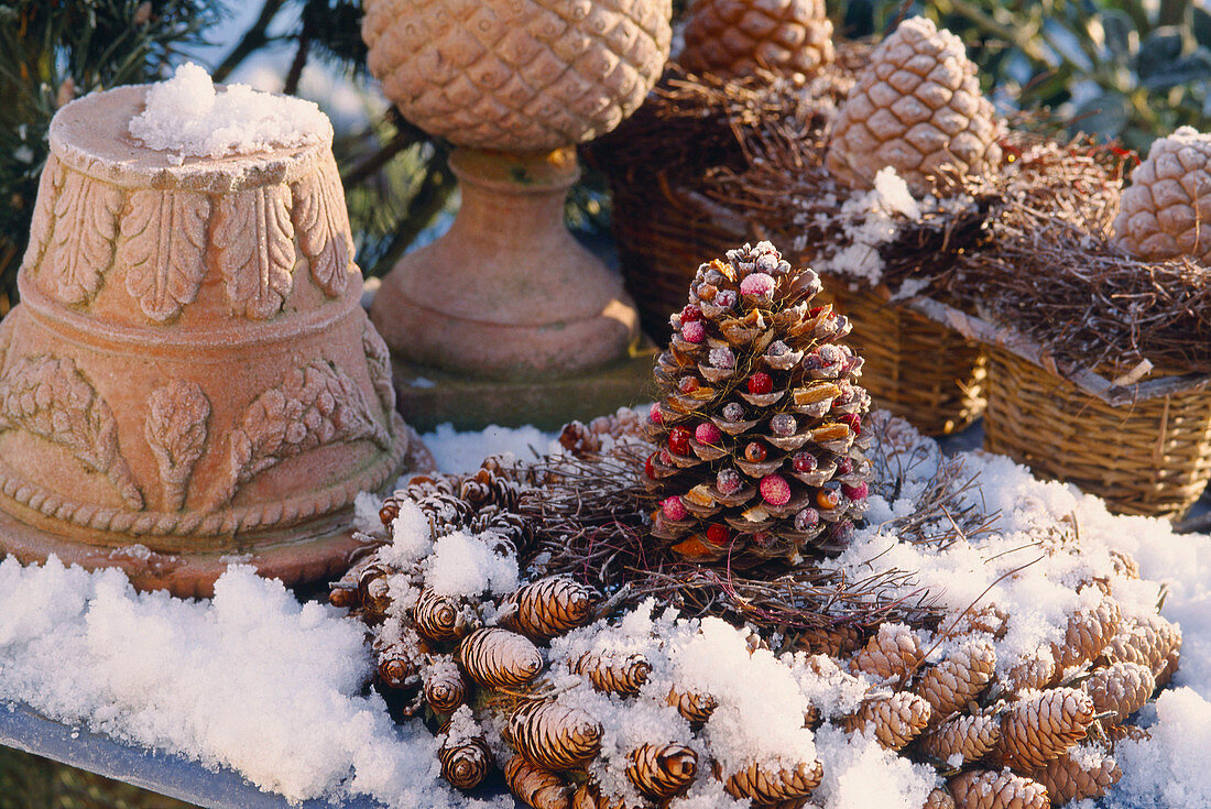 Wreath made of cones, terracotta pots and cones, snow