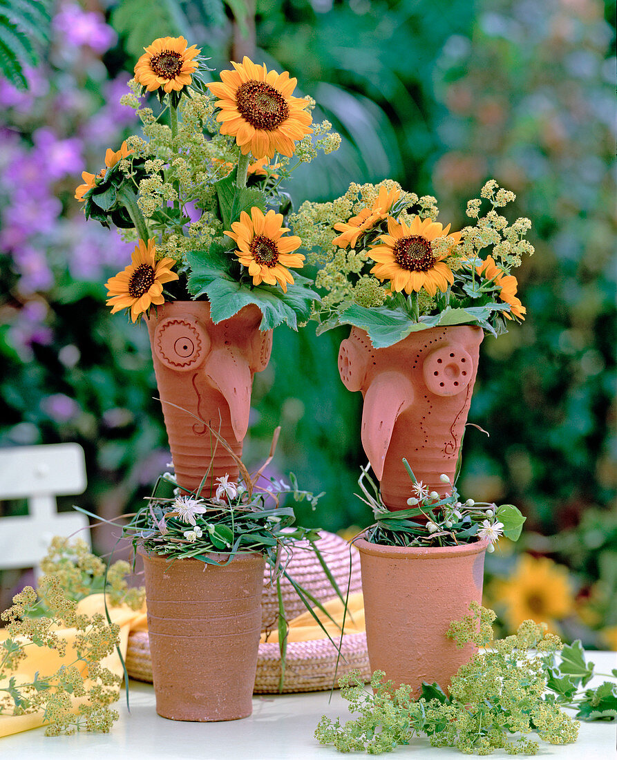 Vases as bird heads, Helianthus (sunflowers)