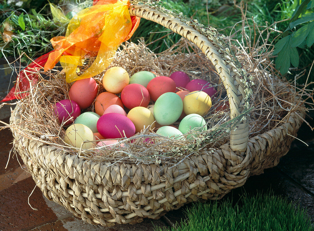 Basket with coloured Easter eggs