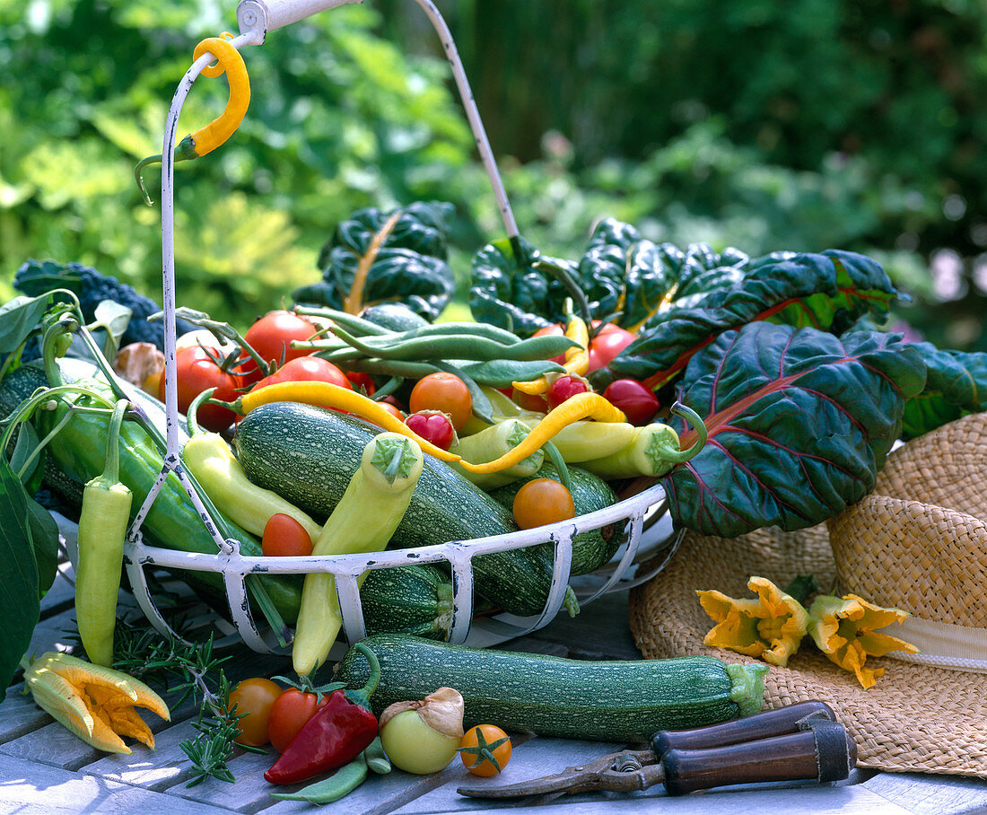 Iron basket with vegetables, peppers, zucchini, beans