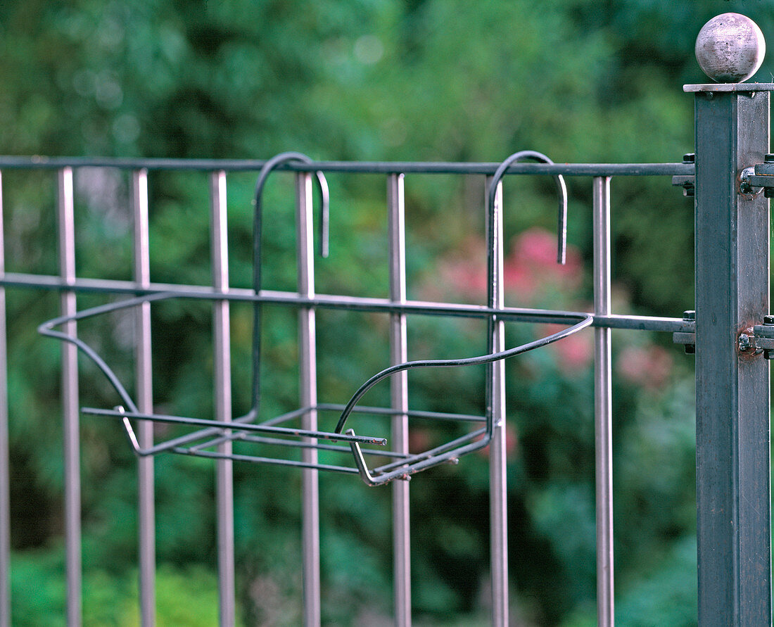 Iron box holder for balcony railing