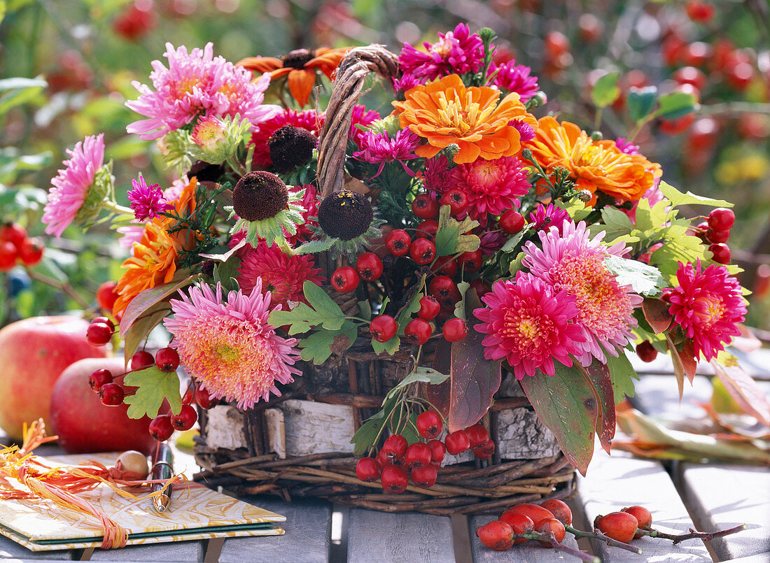 Basket with Callistephus (summer asters), Rudbeckia (coneflowers), Crataegus (hawthorn berries)