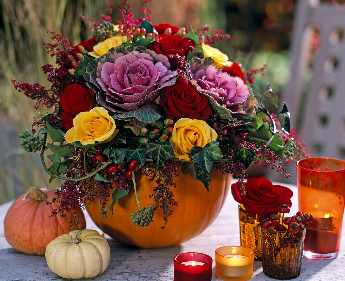 Pumpkin as flower vase: Cucurbita (pumpkins), Brassica (ornamental cabbage)