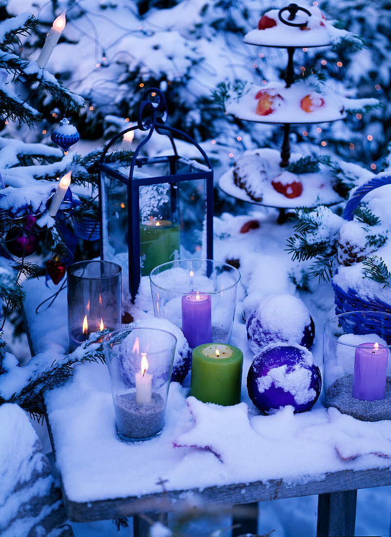 Wind lights, candles, lantern and etagere with Malus (apples)