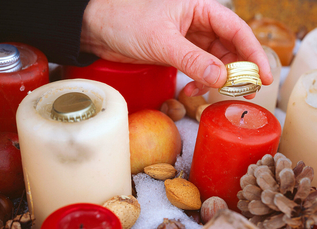 Wick from candles outdoors with water bottle stopper to protect from moisture