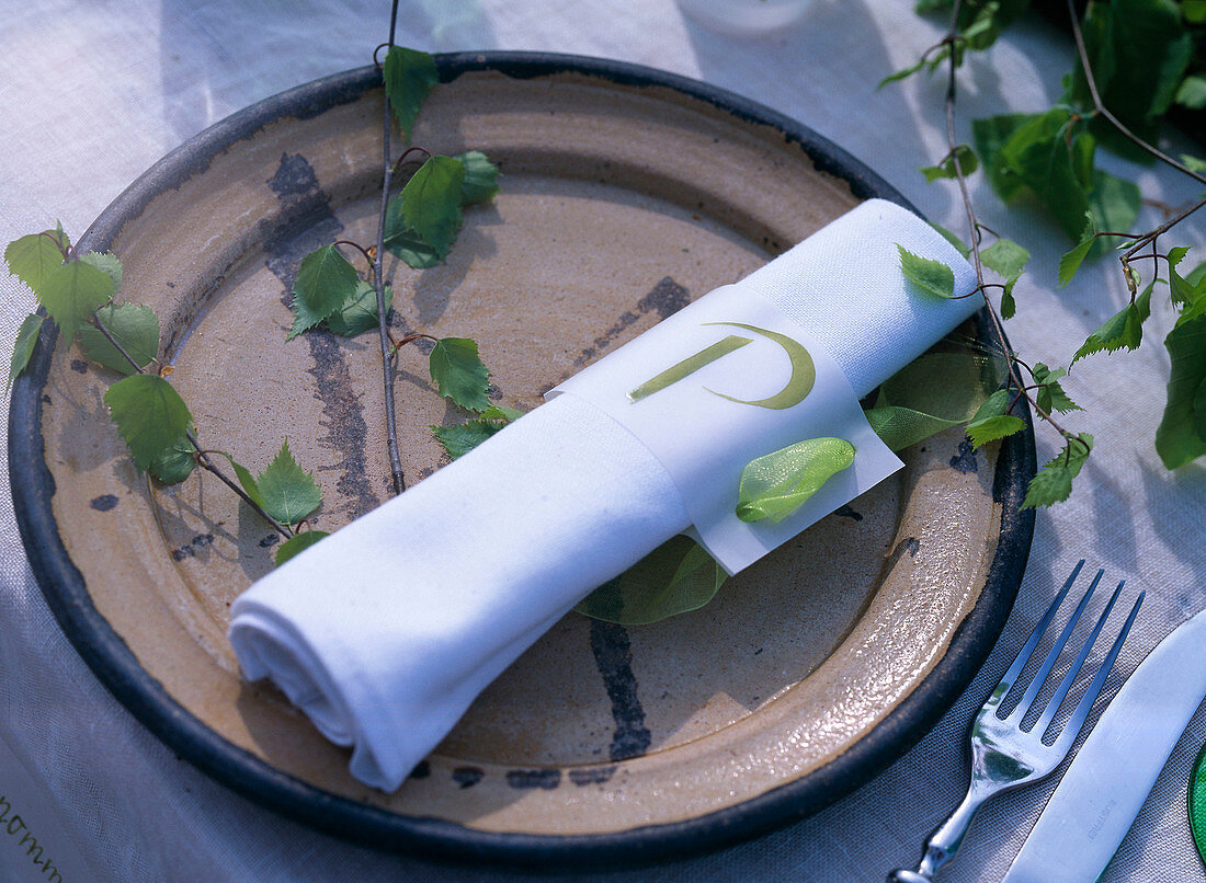 Plate decoration with fresh birch greenery