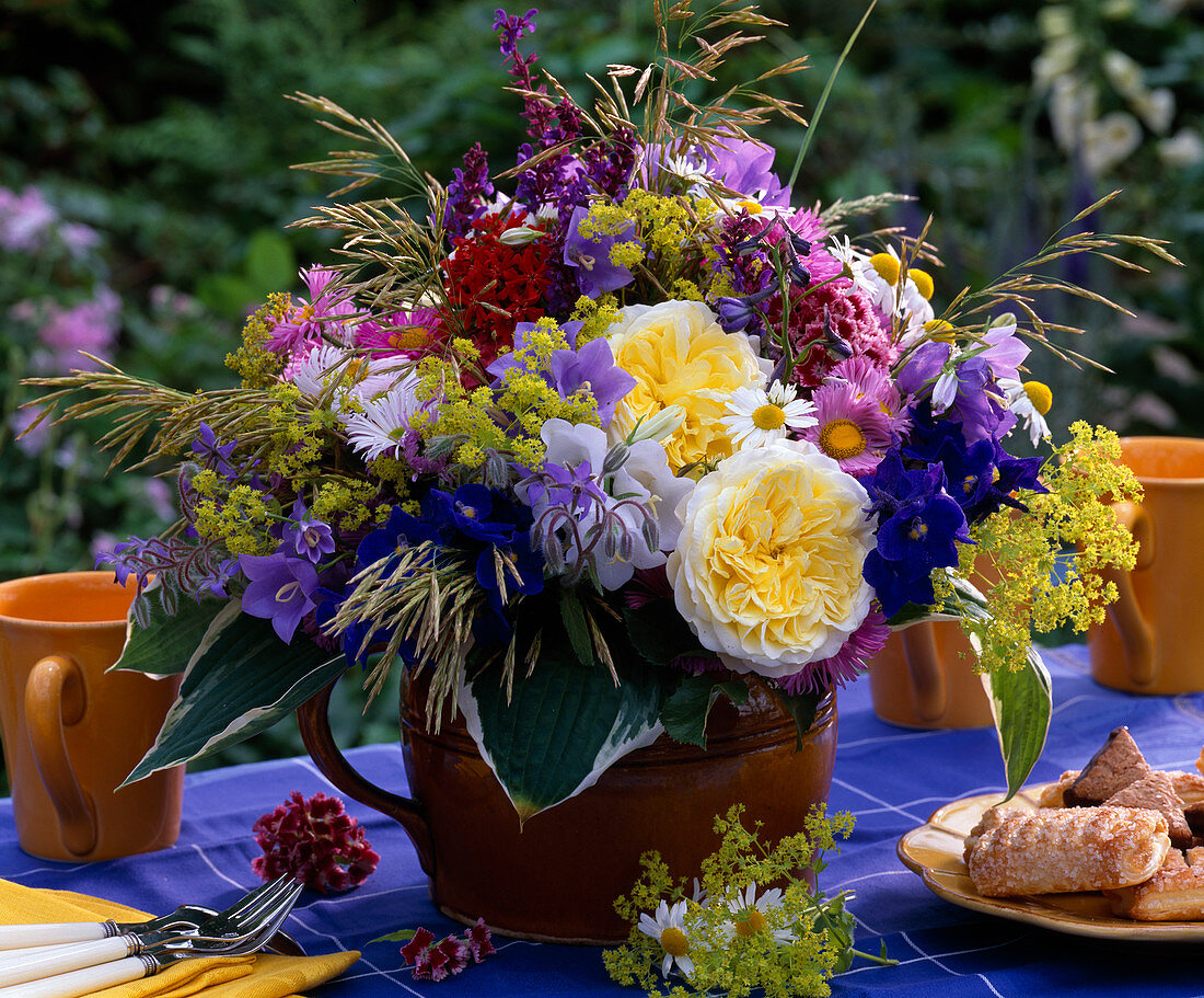 Rosa 'The Pilgrim' (English rose), Campanula (bluebells)