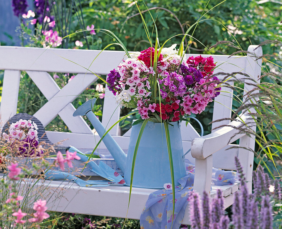 Tin watering can with phlox