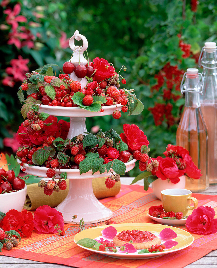 Porcelain etagere with Prunus cherries, Fragaria strawberries, Ribes