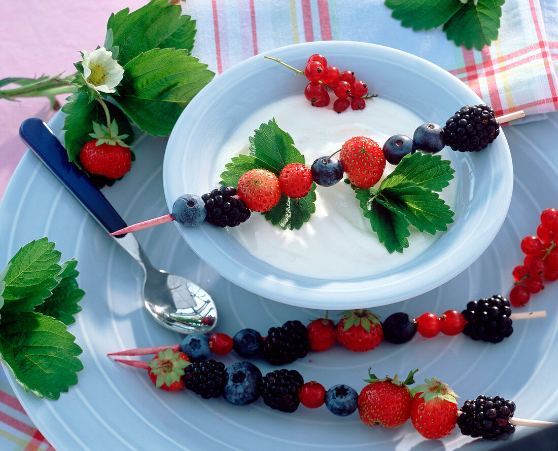 Yoghurt (curd) with berry skewers