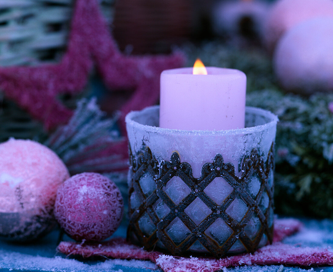 Frozen lantern with pink candle