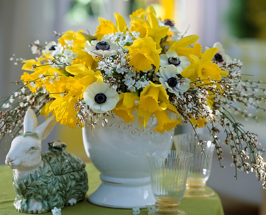 Yellow-white Easter bouquet of daffodils, anemones and broom