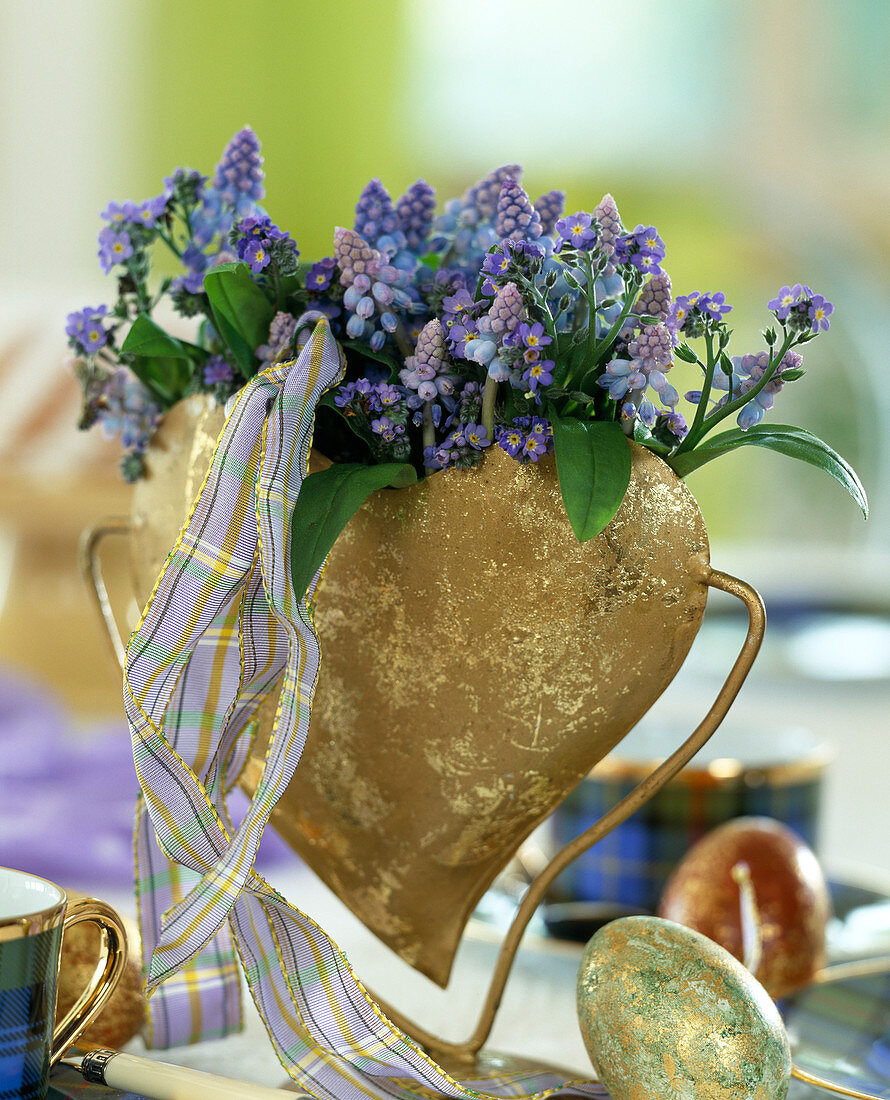 Heart vase of gold plate with muscari (grape hyacinths)