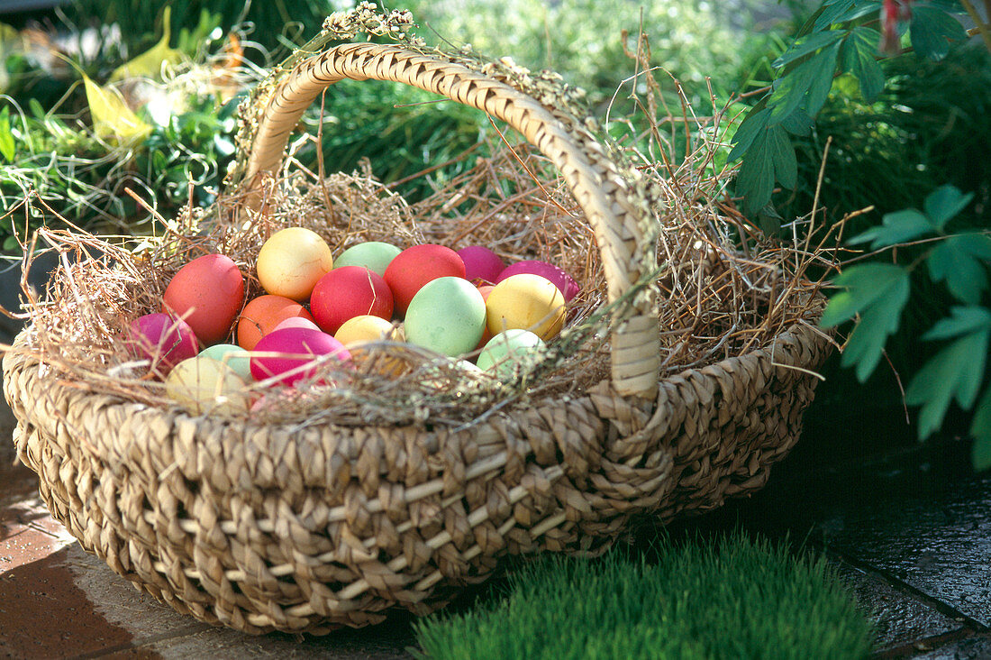 Basket with coloured Easter eggs