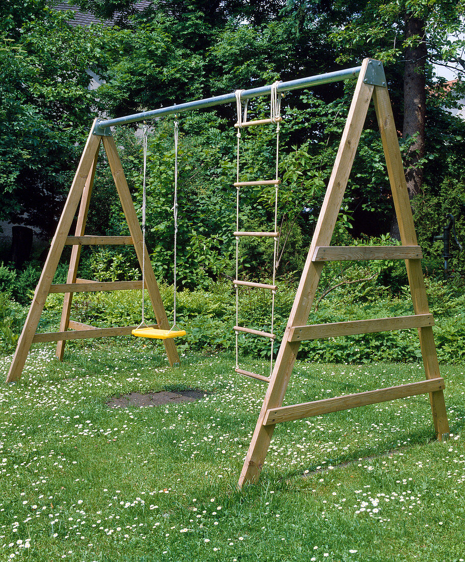 Children swing in the lawn