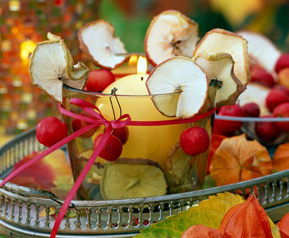 Glass, filled and decorated with malus