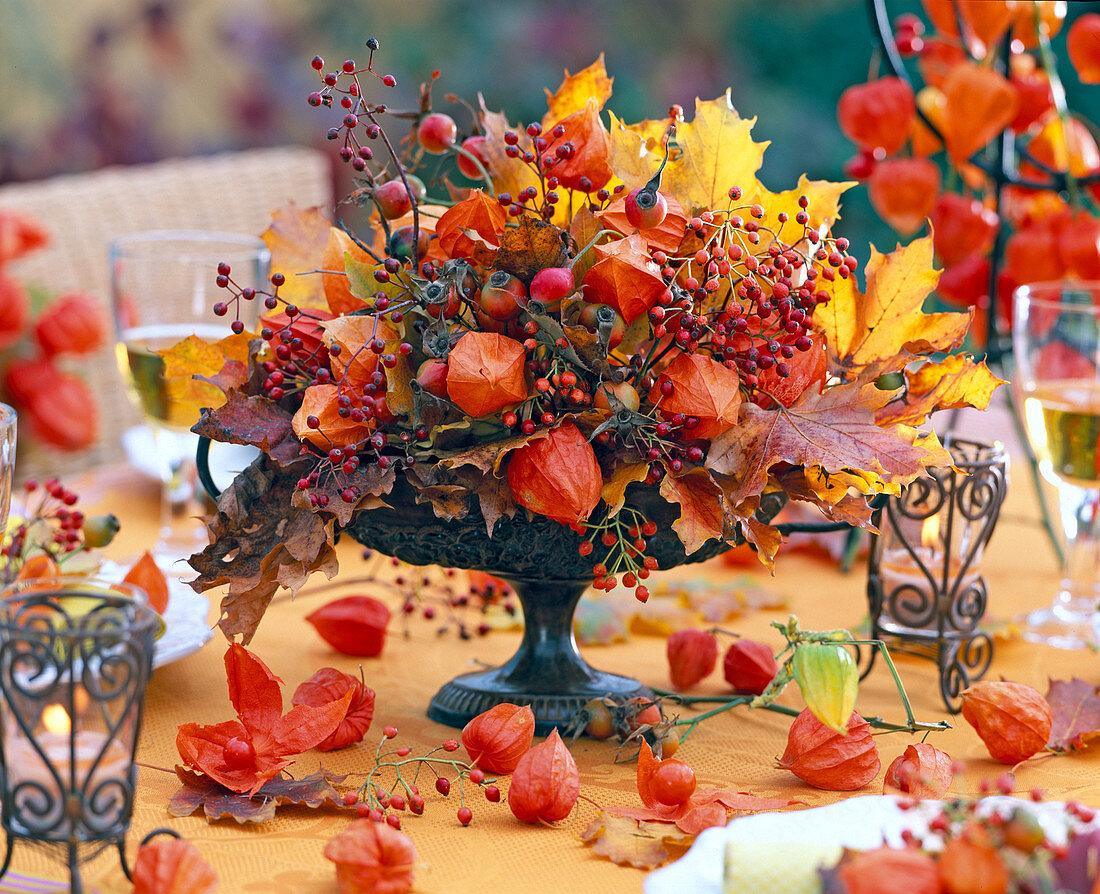 Autumn arrangement in footed iron vessel