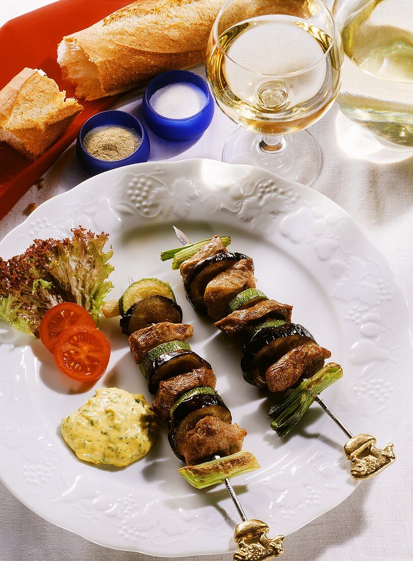 Beef Zucchini Eggplant and Leek Skewers on a Plate