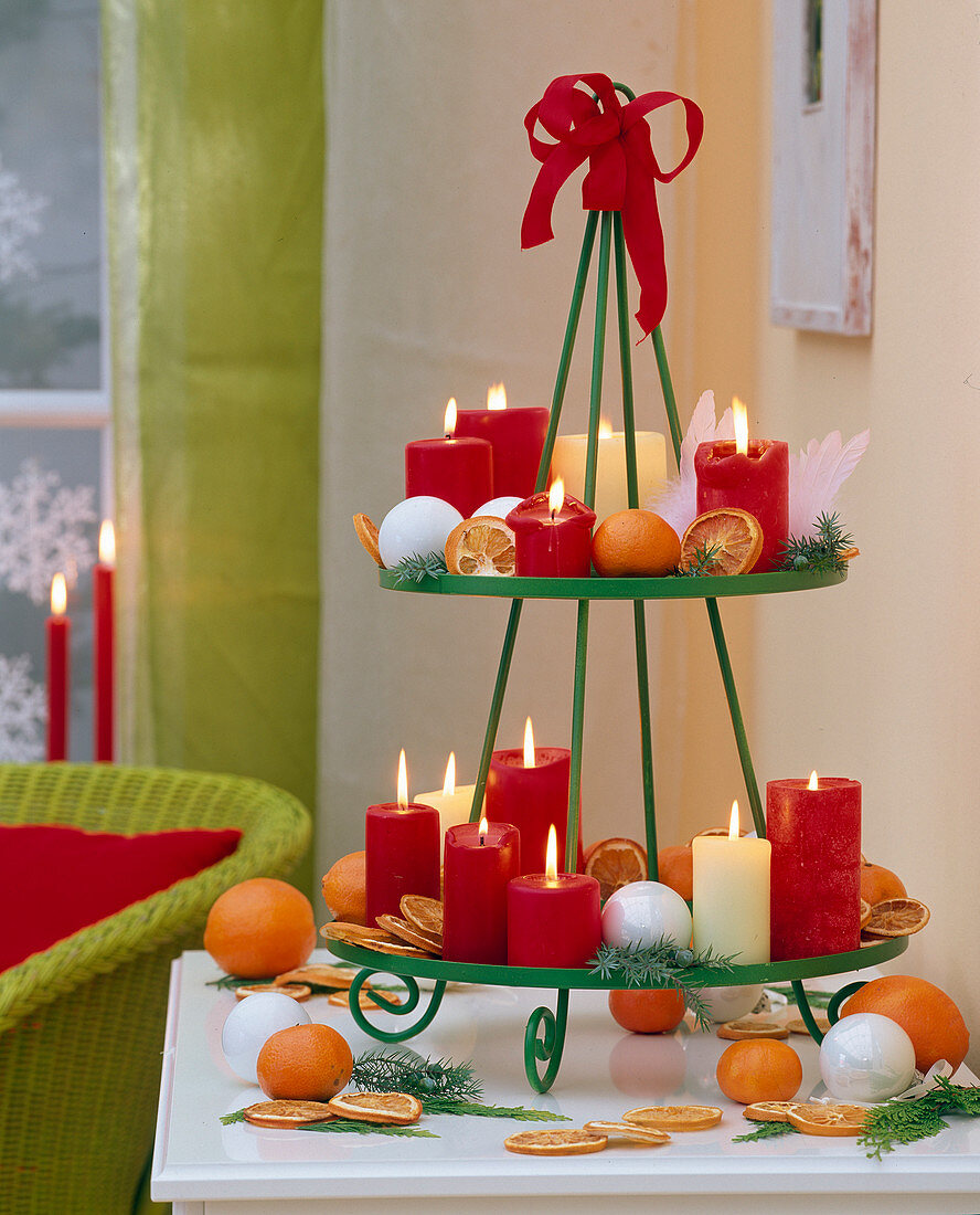 Metal tray, painted green with red candles, citrus (orange, mandarin)