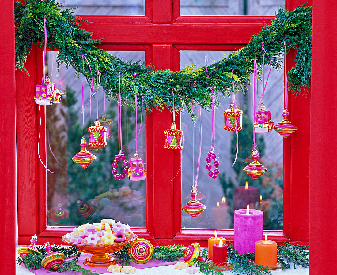 Coniferous garland at the window