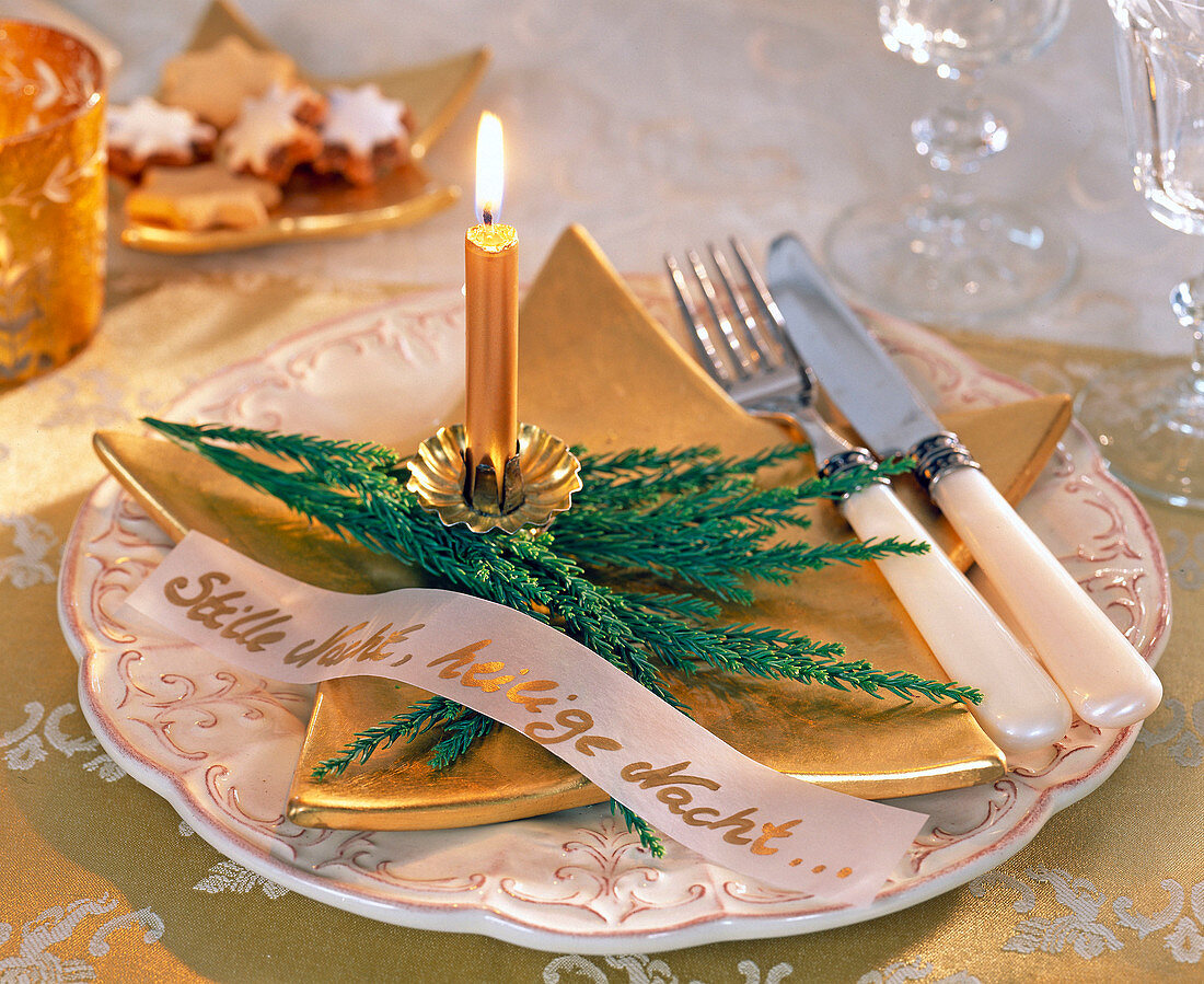 Plate decoration with golden tree candle on branch