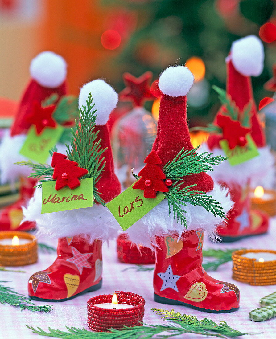 Colorful porcelain St. Nikolaus boots, decorated with red felt cap