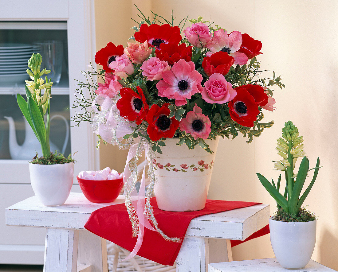 Bouquet of anemones with pink (roses), pittosporum (sticky seeds)