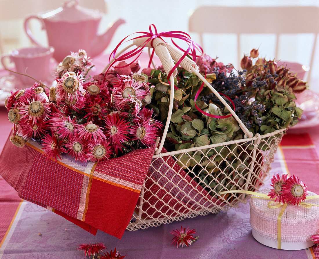 Basket with dried flowers: Helichrysum (strawflowers), Hydrangea (hydrangeas)