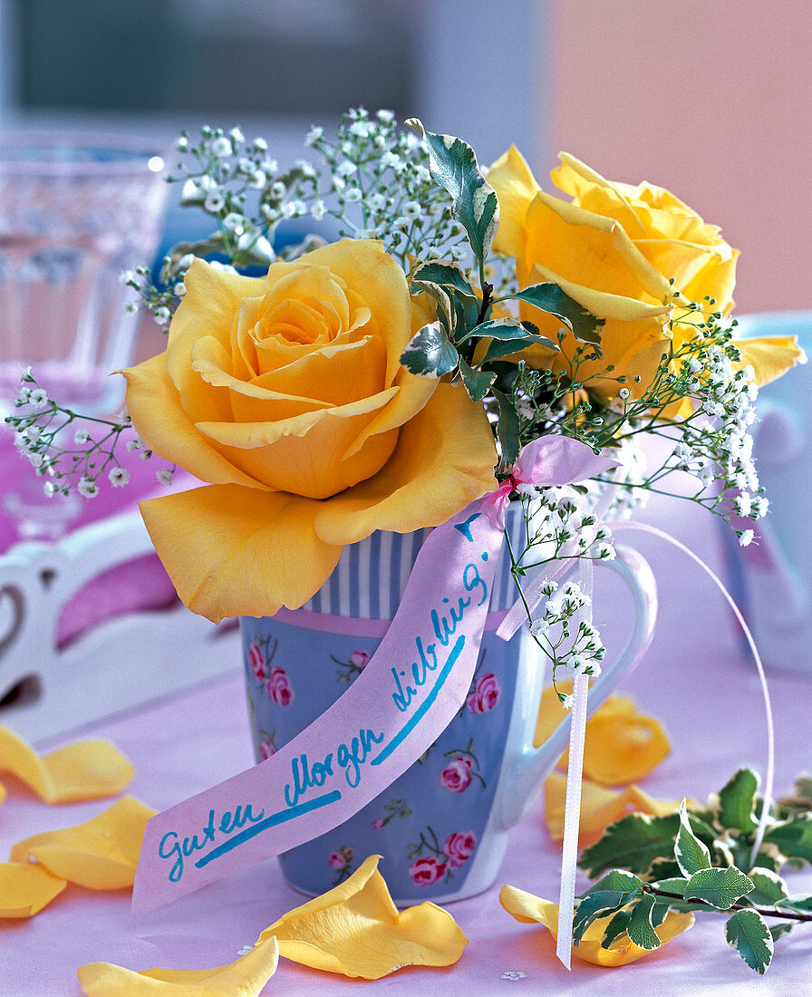 Rose, gypsophila in a patterned vase