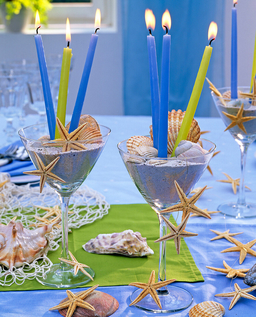 Sundae filled with sea sand and decorated with starfish and shells