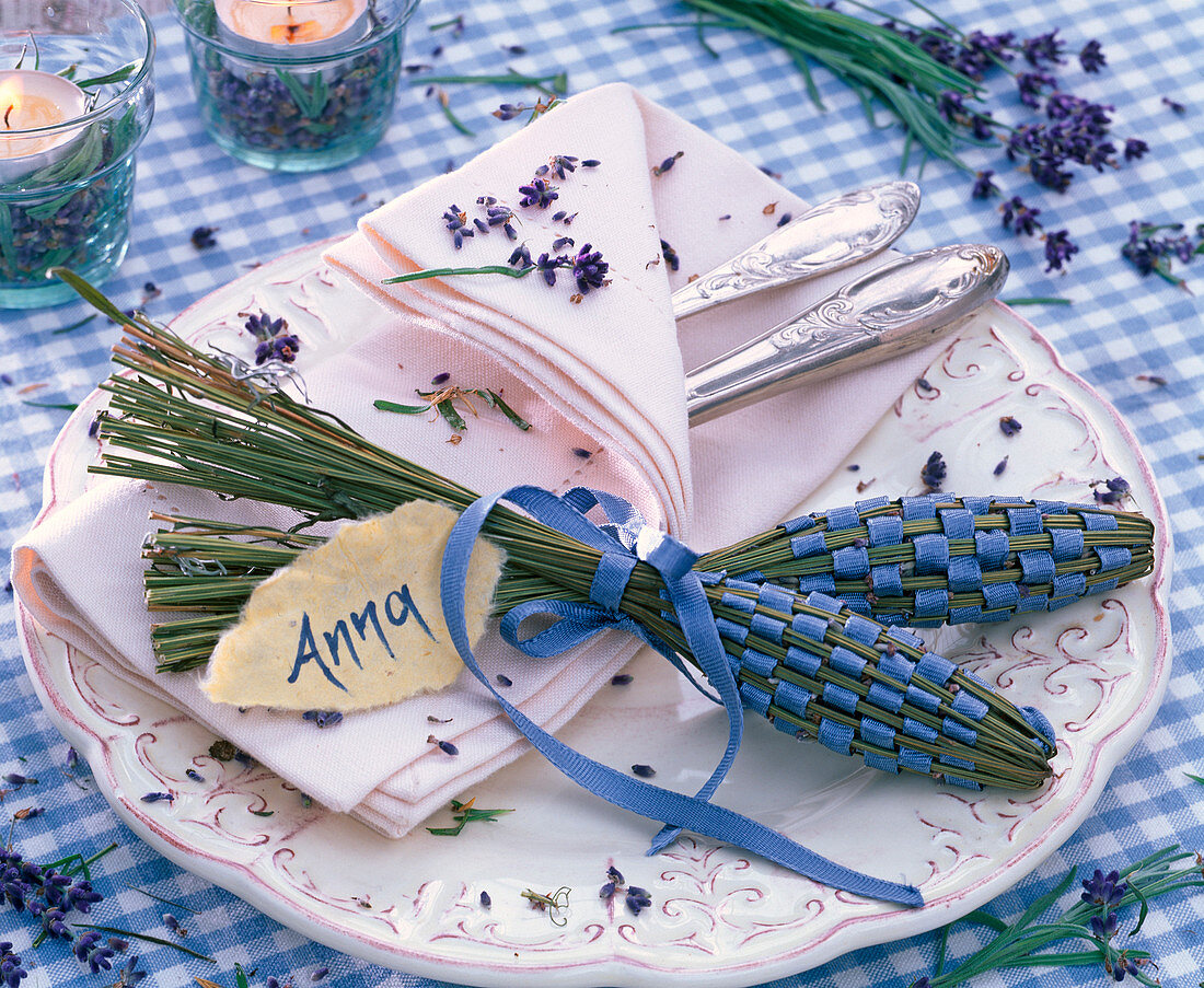 Lavender bottles with lavandula (lavender) and blue ribbons