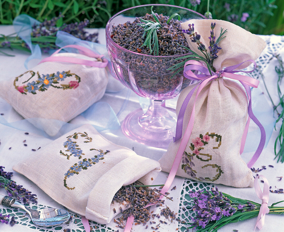 Lavandula dried in glass bowl and embroidered sachets