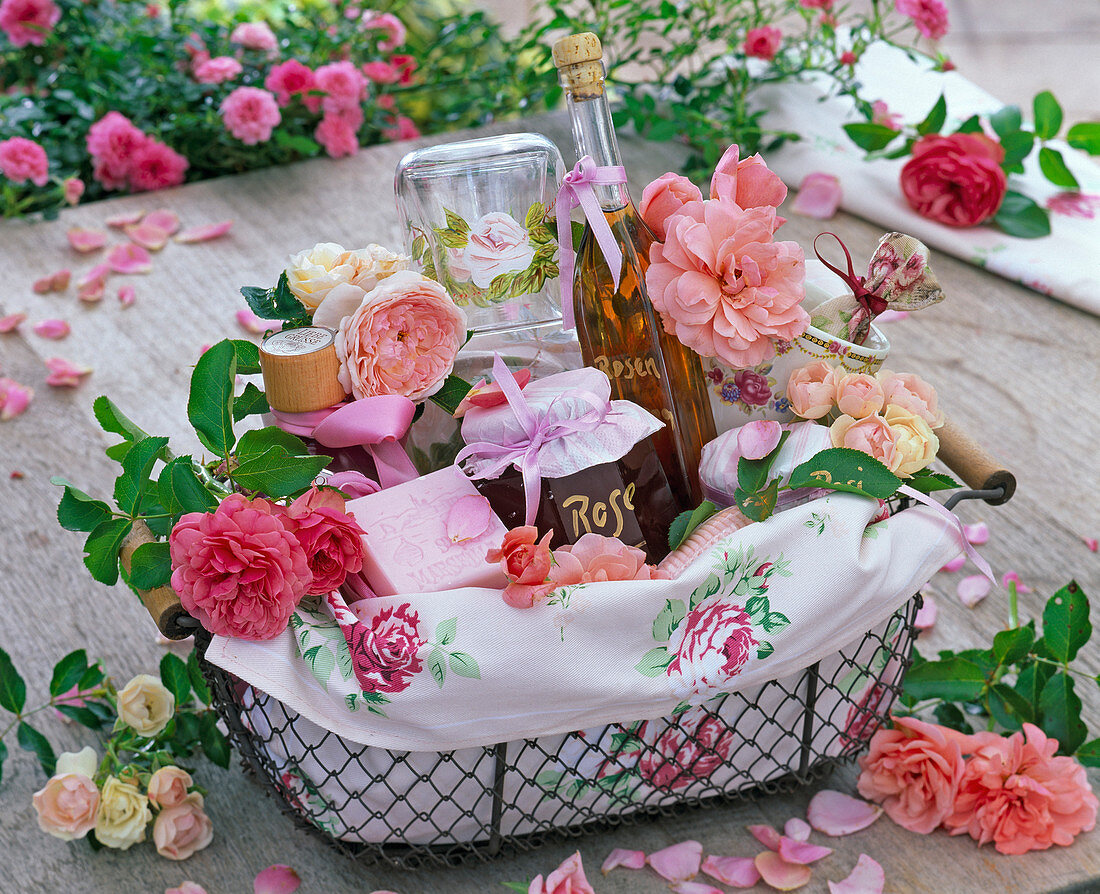 Gift basket with rose flowers, rose jelly, liqueur, and soap