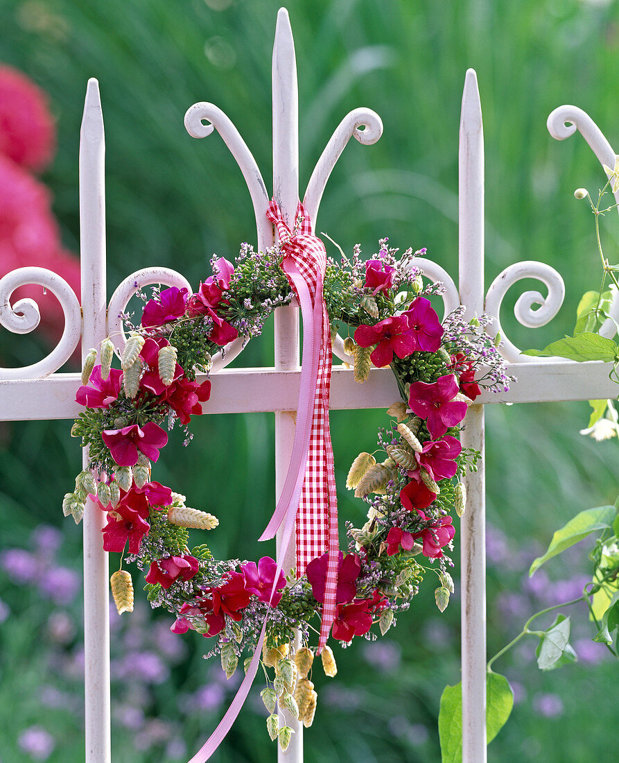 Wreath of flowers of phlox, anethum, limonium