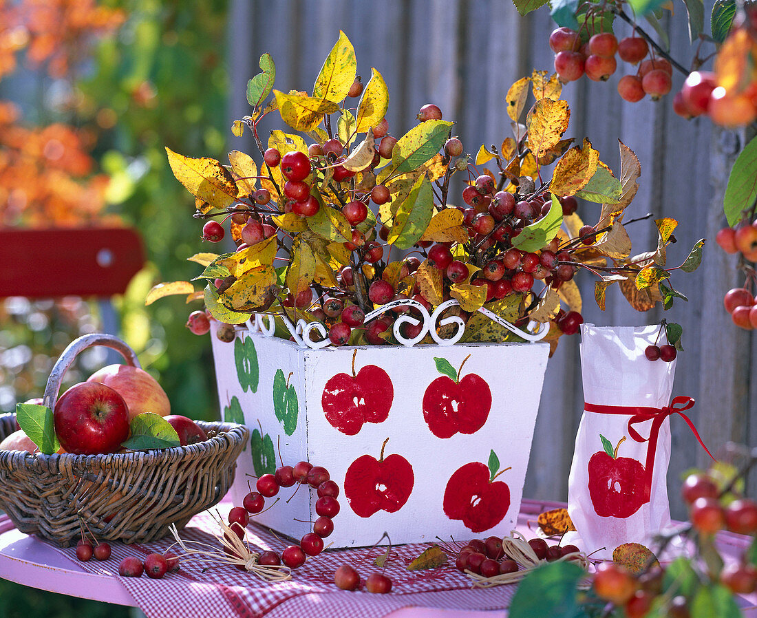 Wooden box and lanterns with apple print