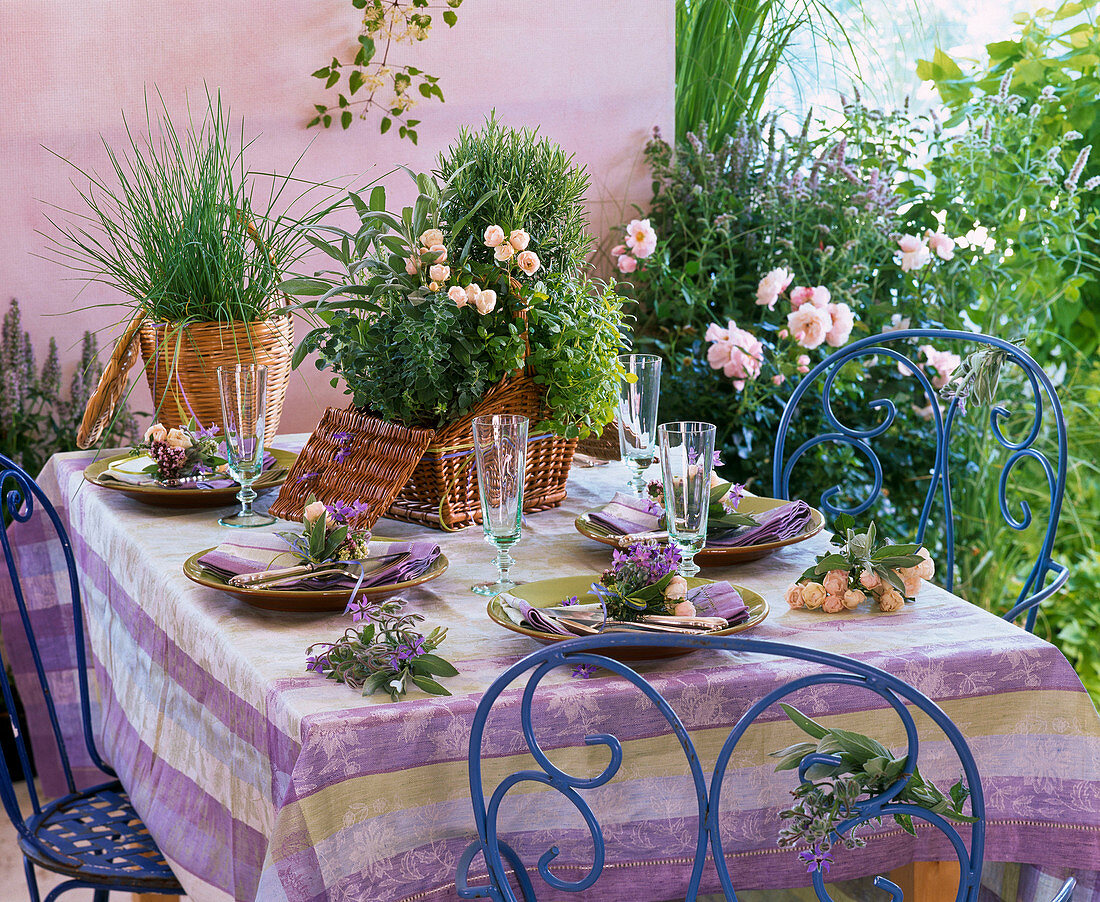 Table decoration with herbs and roses