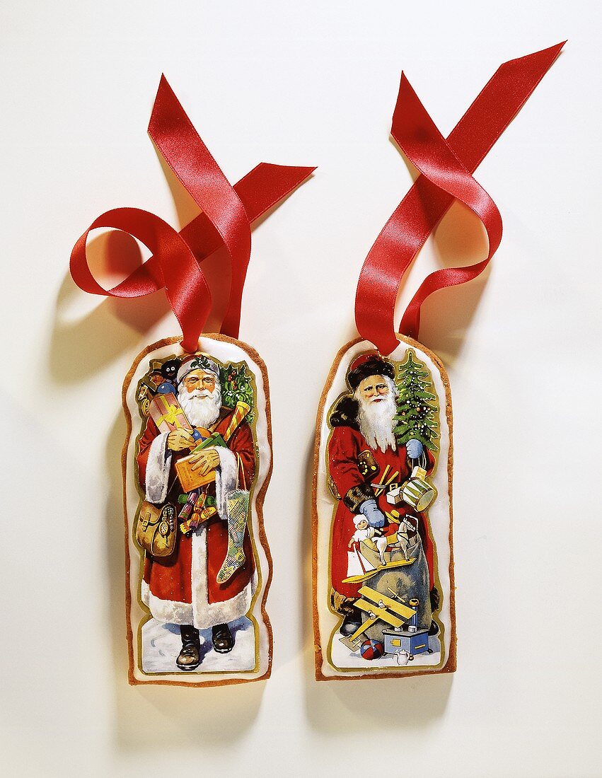 Two Decorated Gingerbread Ornaments with Red Ribbon