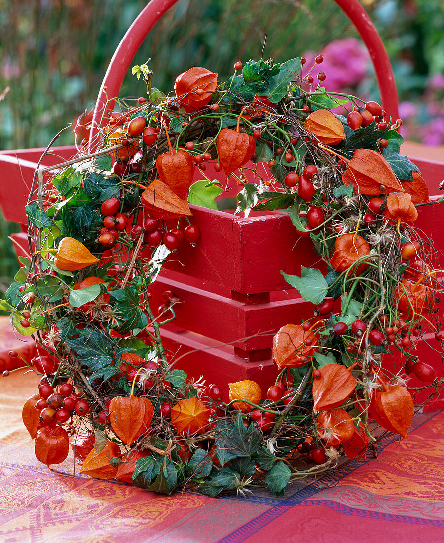 Wreath made of physalis (lampion flowers), rose hips, hedera (ivy), seed heads