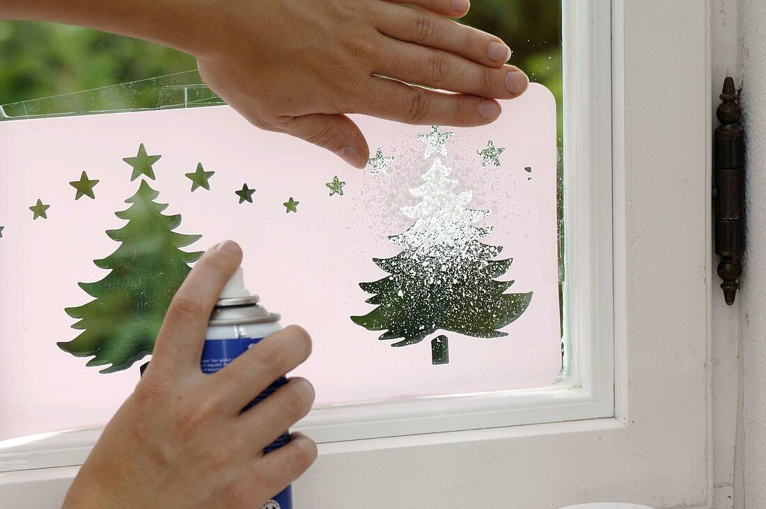 Window decoration with snow spray and template