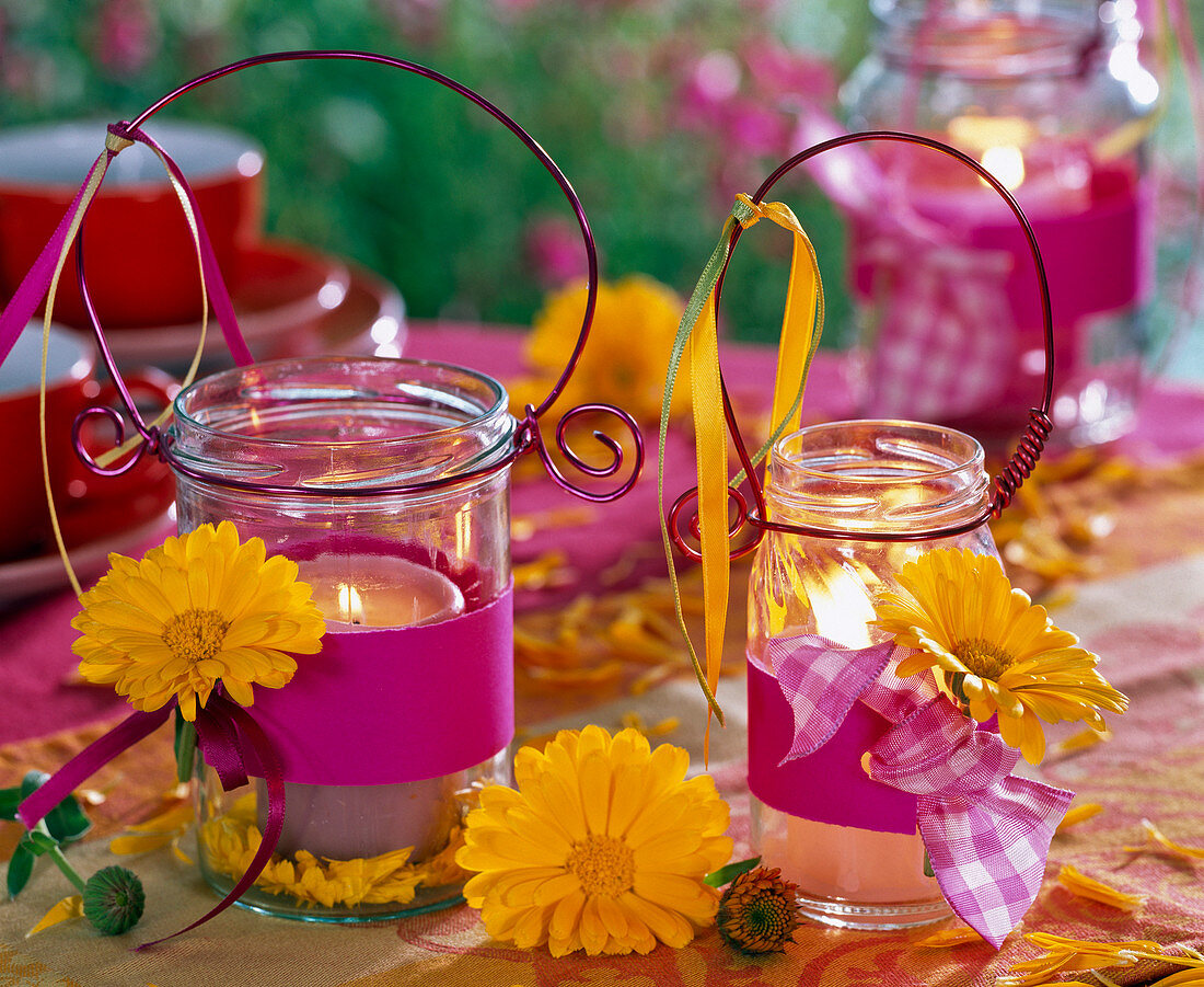 Calendula on screw lid jars as lanterns, band of foam rubber