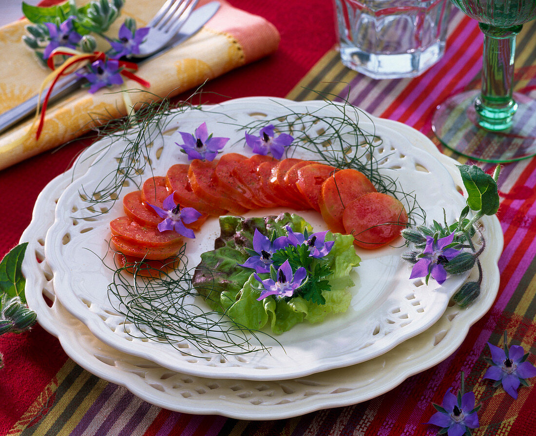 Lycopersicon (tomatoes), Lactuca (lettuce) garnished with Borago