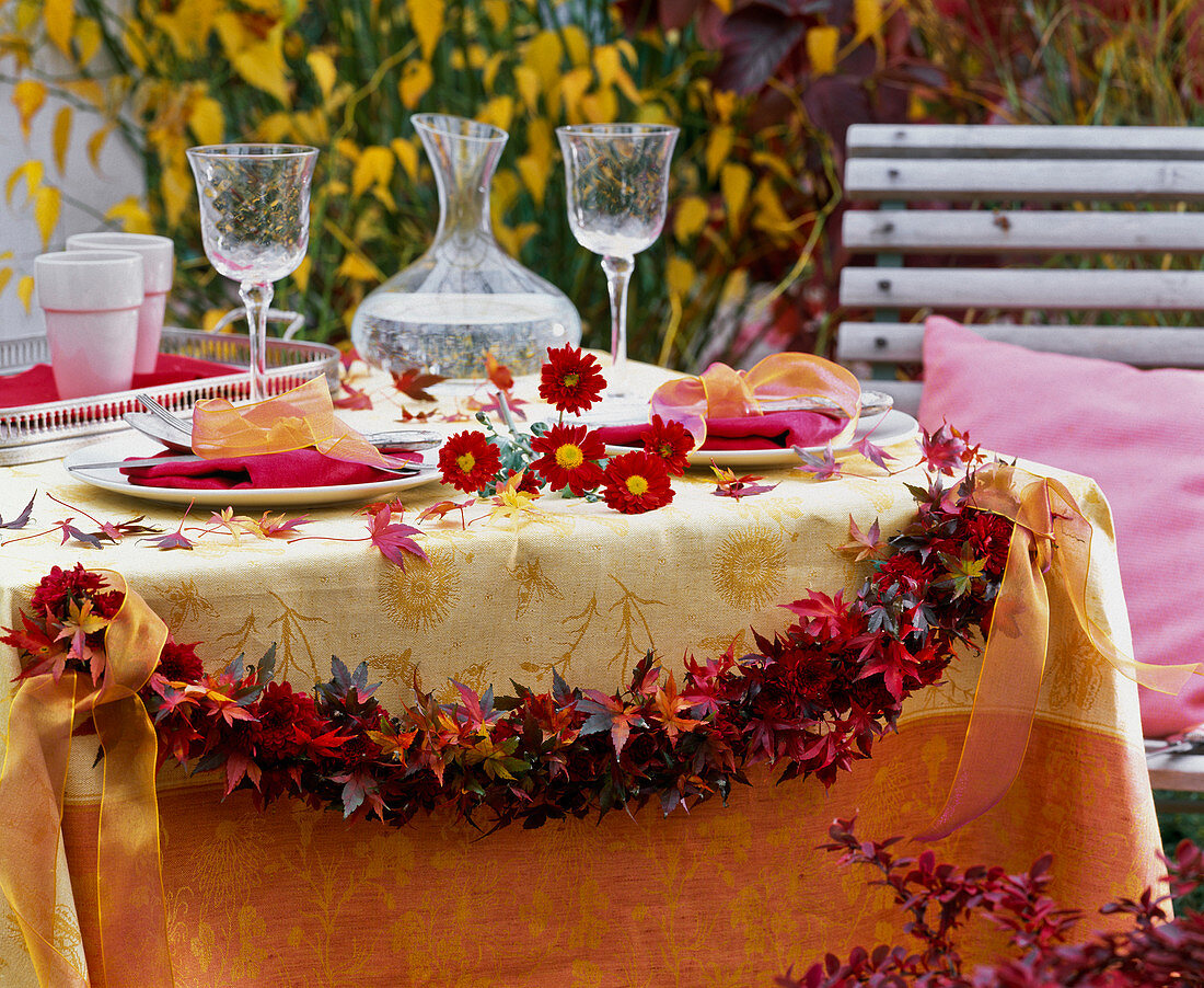 Garland made of autumn Acer (maple) leaves and Chrysanthemum