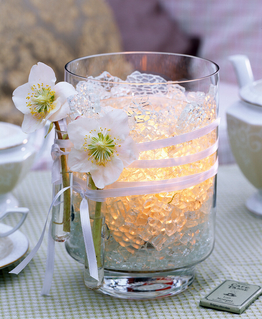 Lantern with Christmas roses and artificial ice